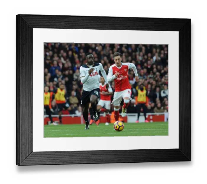 Framed Print : Ozil vs. Wanyama: A Footballing Battle in the Arsenal vs. Tottenham Rivalry (2016-17)
