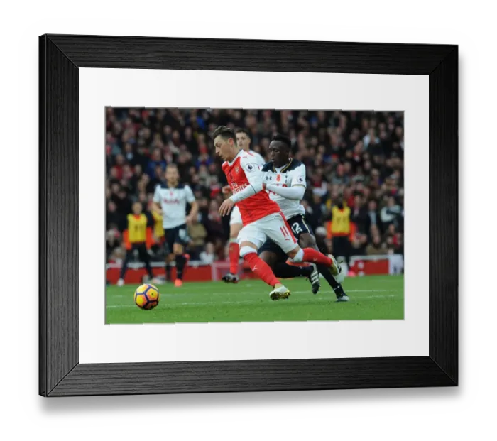 Framed Print : Ozil vs. Wanyama: A Premier League Showdown at the Emirates (2016-17) Framed Print : Ozil vs. Wanyama: A Premier League Showdown at the Emirates (2016-17)