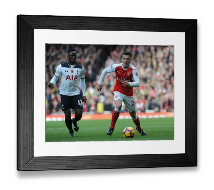 Framed Print : Arsenal vs. Tottenham: Intense Battle - Xhaka vs. Wanyama