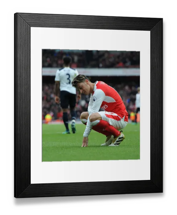 Framed Print : Disappointed Mesut Ozil: Arsenal's Agonizing Defeat to Tottenham Hotspur, Premier League 2016-17