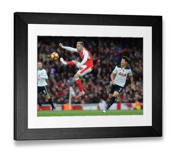 Framed Print : Arsenal vs. Tottenham: Ramsey vs. Son - Premier League Clash at Emirates Stadium (2016-17) Framed Print : Arsenal vs. Tottenham: Ramsey vs. Son - Premier League Clash at Emirates Stadium (2016-17)