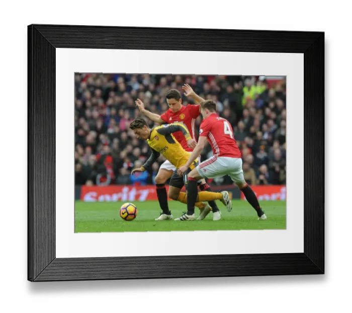 Framed Print : Mesut Ozil Clashes with Manchester United's Herrera and Jones during the 2016-17 Premier League Match Framed Print : Mesut Ozil Clashes with Manchester United's Herrera and Jones during the 2016-17 Premier League Match
