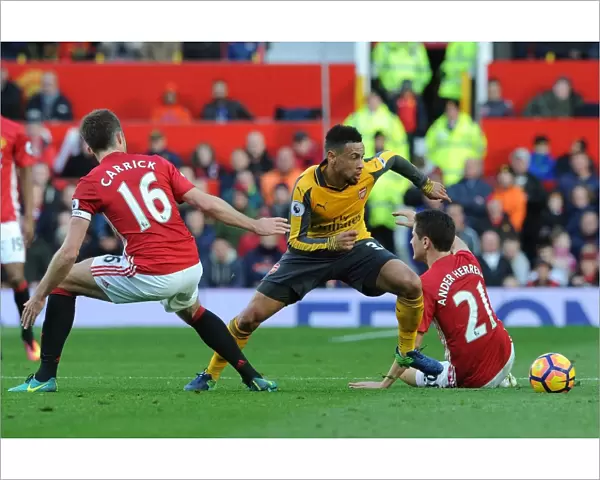 Clash at Old Trafford: Coquelin Stands Firm Against United's Midfield Trio