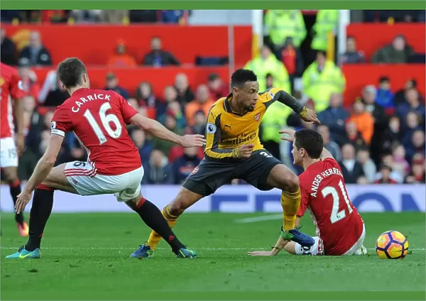 Clash at Old Trafford: Coquelin Stands Firm Against United's Midfield Trio