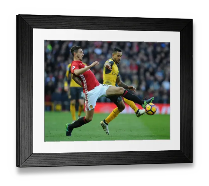 Framed Print : Theo Walcott vs. Matteo Darmian: A Premier League Showdown at Old Trafford (2016-17)