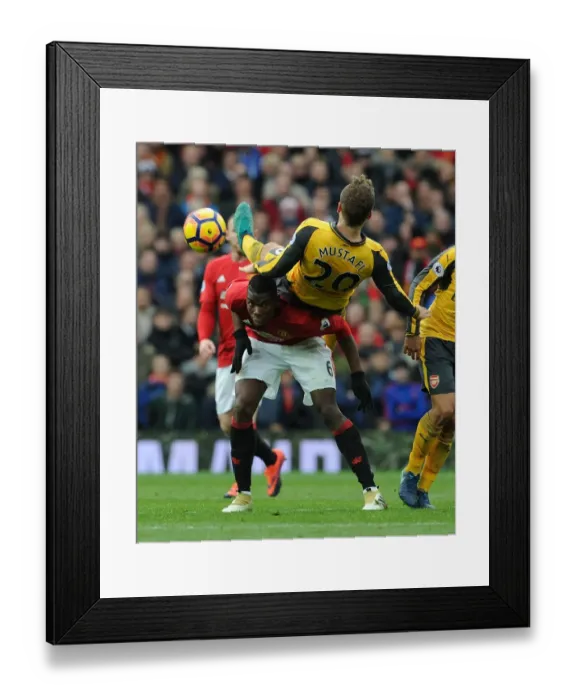 Framed Print : Mustafi vs. Pogba: A Premier League Battle at Old Trafford - Manchester United vs. Arsenal, 2016-17 Framed Print : Mustafi vs. Pogba: A Premier League Battle at Old Trafford - Manchester United vs. Arsenal, 2016-17