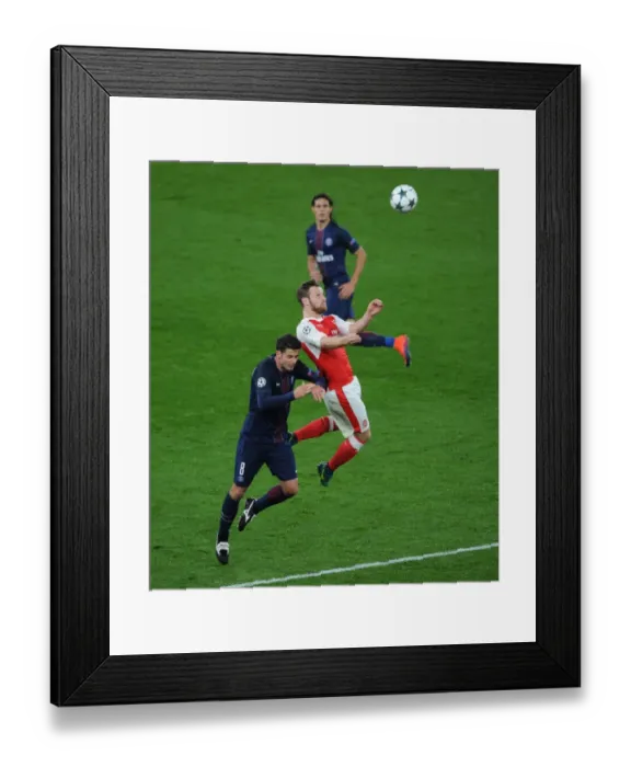 Framed Print : Mustafi Leaps Above Motta: Arsenal vs. Paris Saint-Germain, UEFA Champions League, 2016 Framed Print : Mustafi Leaps Above Motta: Arsenal vs. Paris Saint-Germain, UEFA Champions League, 2016