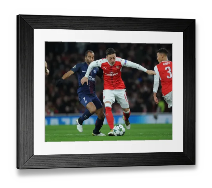 Framed Print : Arsenal vs Paris Saint-Germain: Mesut Ozil Breaks Through PSG Defense in 2016-17 Champions League Clash