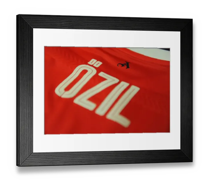 Framed Print : Mesut Ozil in the Arsenal Changing Room Before Arsenal vs Paris Saint-Germain - UEFA Champions League 2016-17
