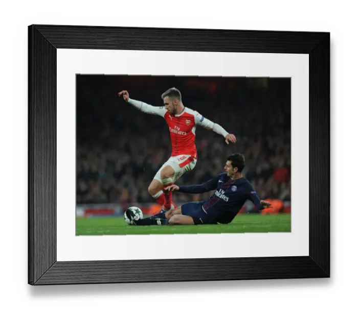 Framed Print : Arsenal's Aaron Ramsey Fouled by Thiago Motta in 2016-17 Champions League Match