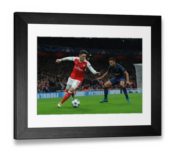 Framed Print : Mesut Ozil vs. Marquinhos: A Champions League Battle at Emirates Stadium