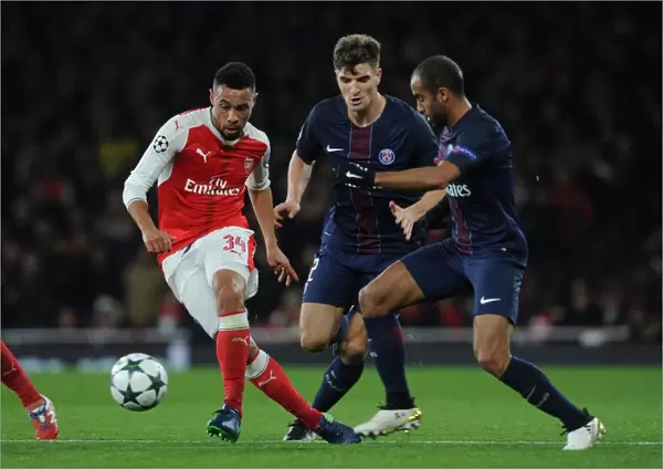 Coquelin Under Fire: Arsenal's Midfielder Battles Meunier and Moura in Intense Arsenal vs. Paris Saint-Germain Champions League Clash