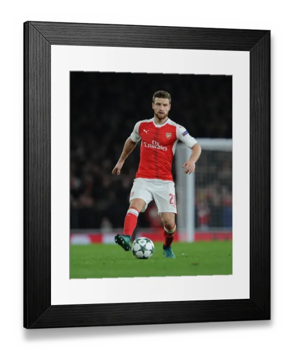 Framed Print : Mustafi's Emirates Battle: Arsenal vs Paris Saint-Germain (Champions League 2016-17)