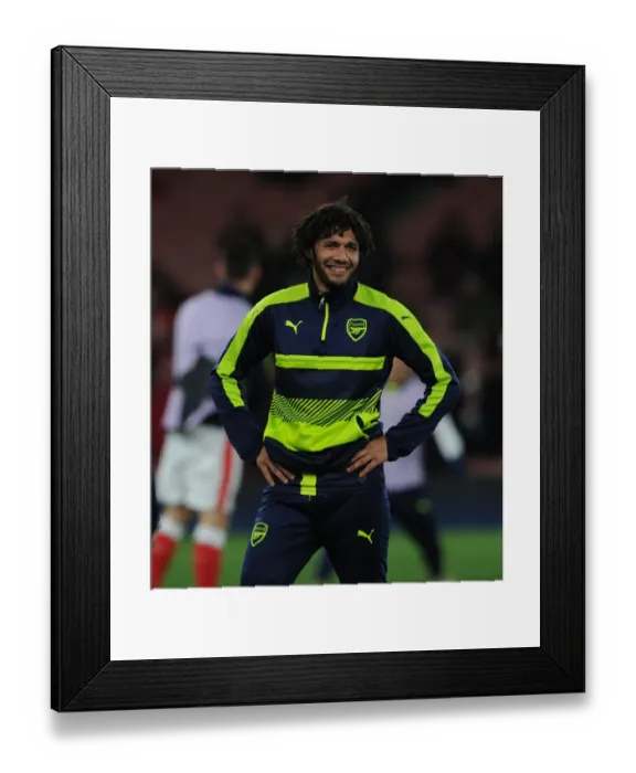 Framed Print : Arsenal's Mohamed Elneny: Key Focus Against Paris Saint-Germain in UCL Showdown
