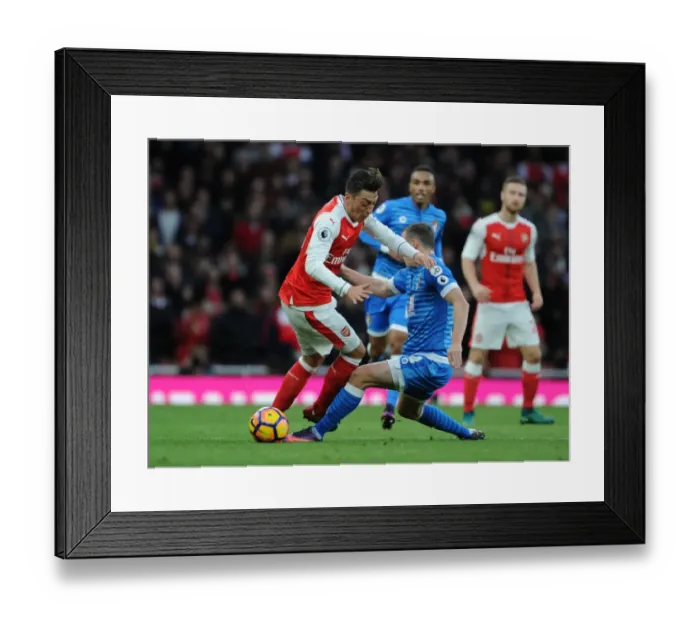 Framed Print : Arsenal vs. AFC Bournemouth: Mesut Ozil vs. Dan Gosling Battle at Emirates Stadium