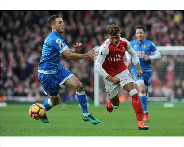 Intense Face-Off: Oxlade-Chamberlain vs. Gosling in Arsenal's Battle Against AFC Bournemouth (2016)