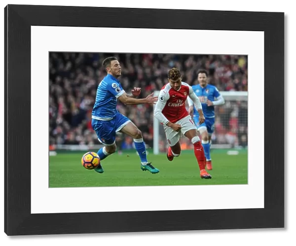 Intense Face-Off: Oxlade-Chamberlain vs. Gosling in Arsenal's Battle Against AFC Bournemouth (2016)