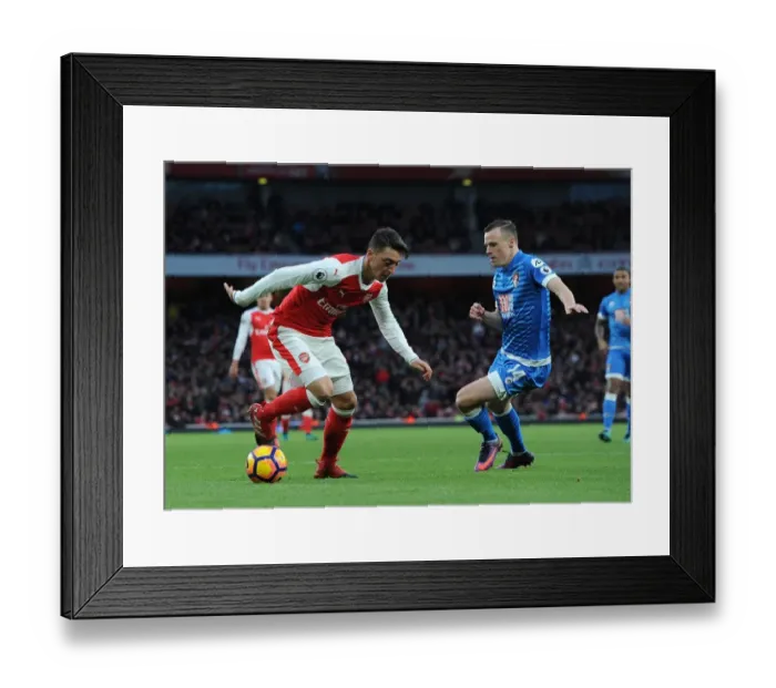 Framed Print : Mesut Ozil (Arsenal) Brad Smith (Bournemouth). Arsenal 3: 1 Bournemouth. Premier League