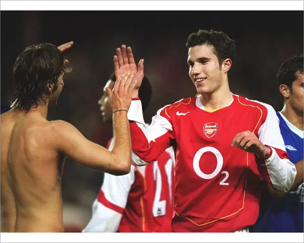 Robin van Persie and Mathieu Flamini celebrate Arsenals win at the end of the match