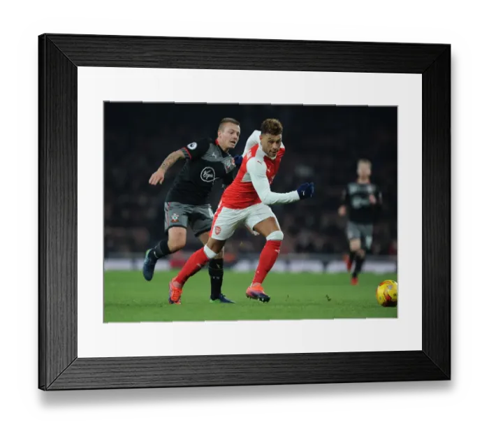 Framed Print : Oxlade-Chamberlain vs Clasie: A Battle in the EFL Cup Quarter-Final between Arsenal and Southampton Framed Print : Oxlade-Chamberlain vs Clasie: A Battle in the EFL Cup Quarter-Final between Arsenal and Southampton