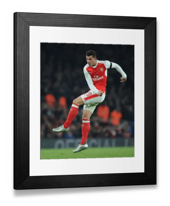 Framed Print : Xhaka's Determination: Arsenal vs. Southampton in EFL Cup Showdown
