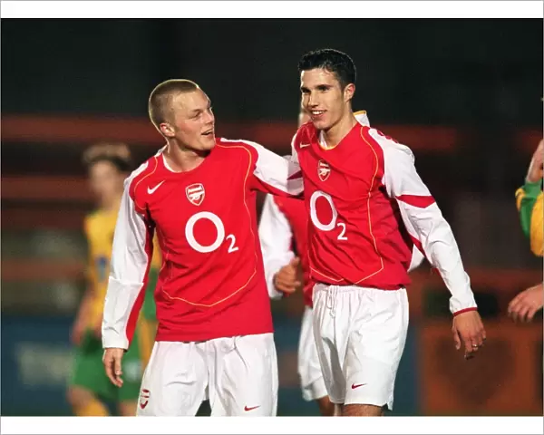 Robin van Persie celebrates scoring for Arsenal with Sebastian Larsson