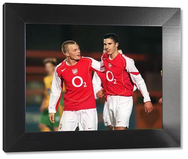 Robin van Persie celebrates scoring for Arsenal with Sebastian Larsson