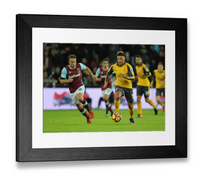 Framed Print : Oxlade-Chamberlain Outwits Noble: Arsenal's Midfield Genius Shines in Premier League Clash