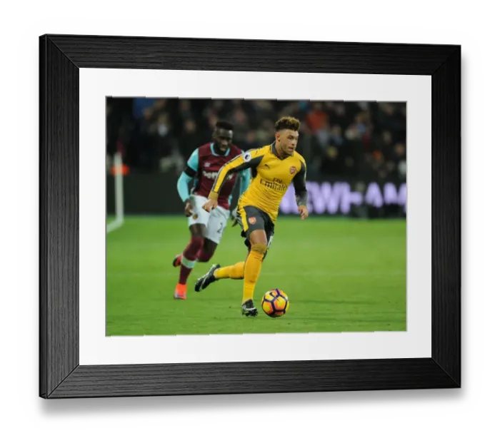 Framed Print : Arsenal's Alex Oxlade-Chamberlain Faces Off Against West Ham in Premier League Showdown