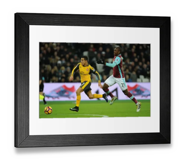 Framed Print : Arsenal's Alexis Sanchez Outmaneuvers West Ham's Angelo Ogbonna in Premier League Clash