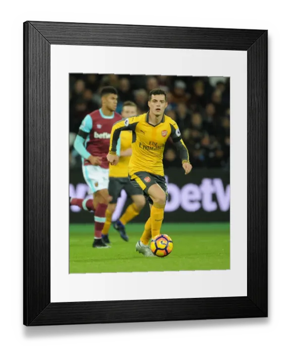 Framed Print : Granit Xhaka in Action: West Ham United vs. Arsenal, Premier League 2016-17