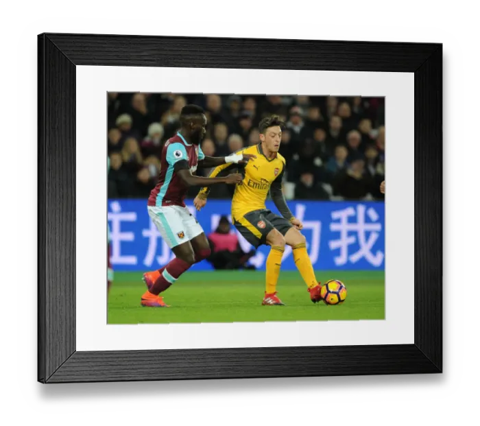 Framed Print : Mesut Ozil vs. Arthur Masuaku: A Premier League Battle - Arsenal vs. West Ham United (December 2016)