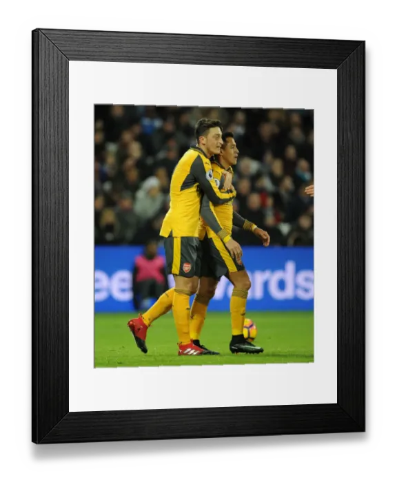 Framed Print : Mesut Ozil and Alexis Sanchez Celebrate First Arsenal Goal vs. West Ham United (2016-17)