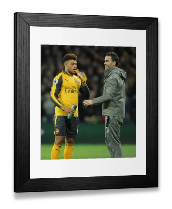 Framed Print : Arsenal's Alex Oxlade-Chamberlain Training with Fitness Coach during West Ham United Match, 2016-17 Framed Print : Arsenal's Alex Oxlade-Chamberlain Training with Fitness Coach during West Ham United Match, 2016-17