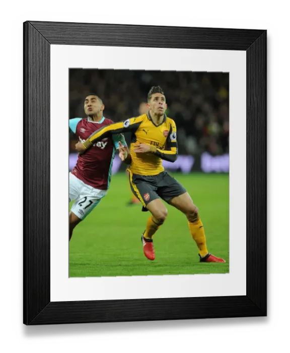 Framed Print : Gabriel vs Payet: Intense Clash Between West Ham and Arsenal in Premier League