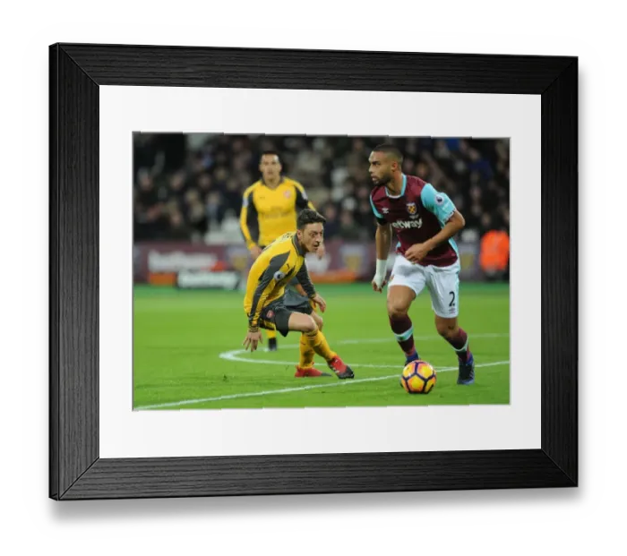 Framed Print : Mesut Ozil Closes Down Winston Reid: Intense Battle Between West Ham and Arsenal (2016-17) Framed Print : Mesut Ozil Closes Down Winston Reid: Intense Battle Between West Ham and Arsenal (2016-17)