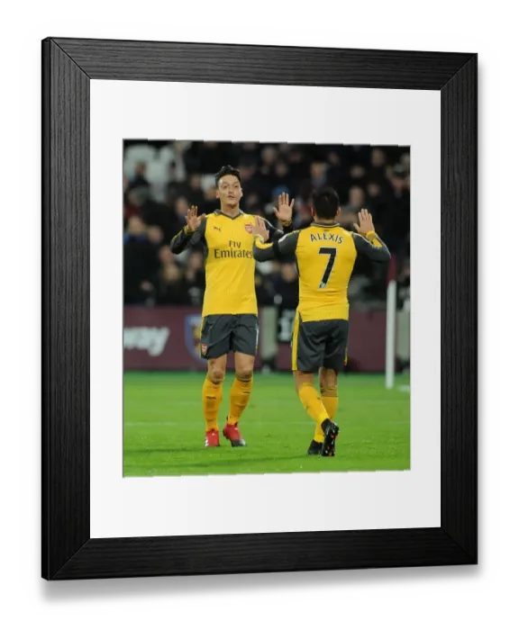 Framed Print : Dazzling Duo: Ozil and Sanchez's Electric Goal Celebration at West Ham United (2016-17)