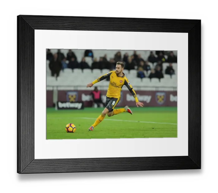 Framed Print : Aaron Ramsey (Arsenal). West Ham United 1: 5 Arsenal. Premier League. London Stadium Framed Print : Aaron Ramsey (Arsenal). West Ham United 1: 5 Arsenal. Premier League. London Stadium