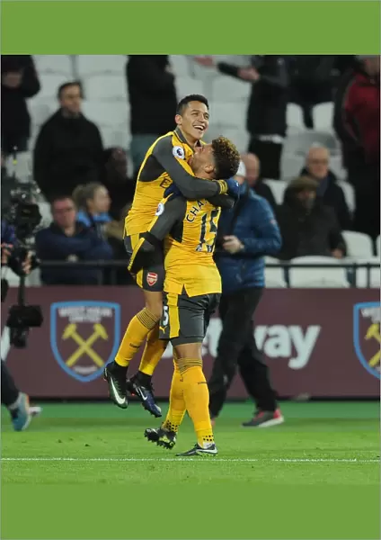 Alexis Sanchez celebrates scoring his 3rd goal, Arsenals 5th, with Alex Oxlade-Chamberlain