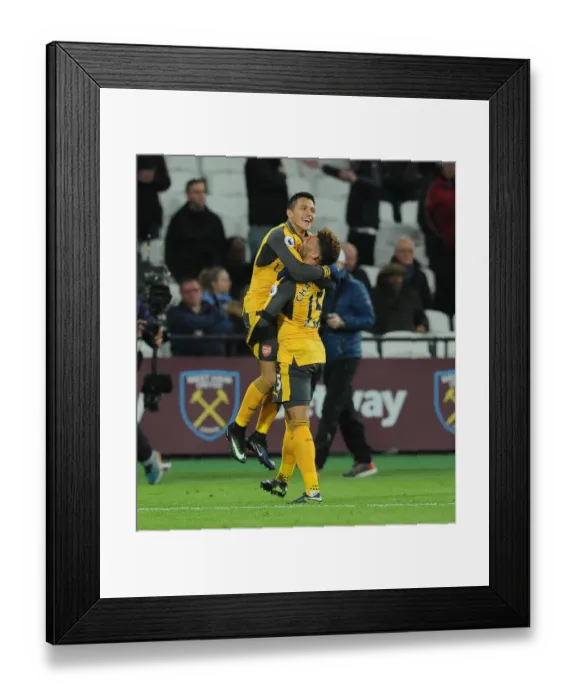 Framed Print : Alexis Sanchez celebrates scoring his 3rd goal, Arsenals 5th, with Alex Oxlade-Chamberlain