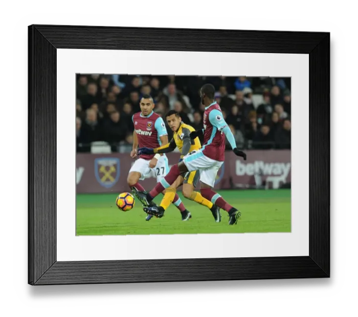 Framed Print : Sanchez Evades Obiang: Intense Moment from West Ham vs. Arsenal Premier League Clash Framed Print : Sanchez Evades Obiang: Intense Moment from West Ham vs. Arsenal Premier League Clash