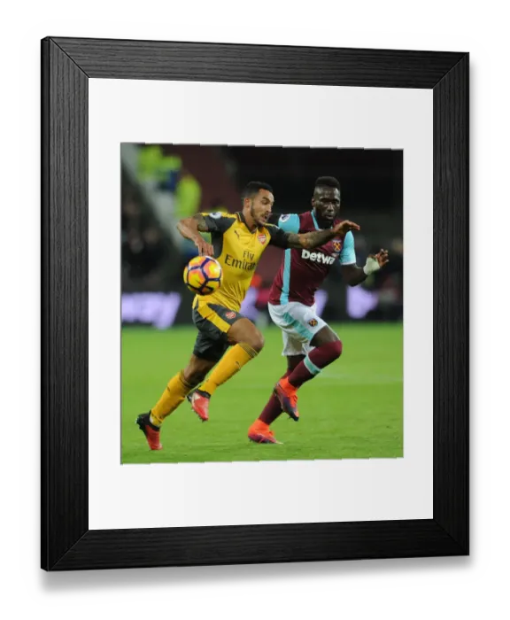 Framed Print : Theo Walcott vs. Arthur Masuaku: A Strategic Battle in the Arsenal vs. West Ham Premier League Clash