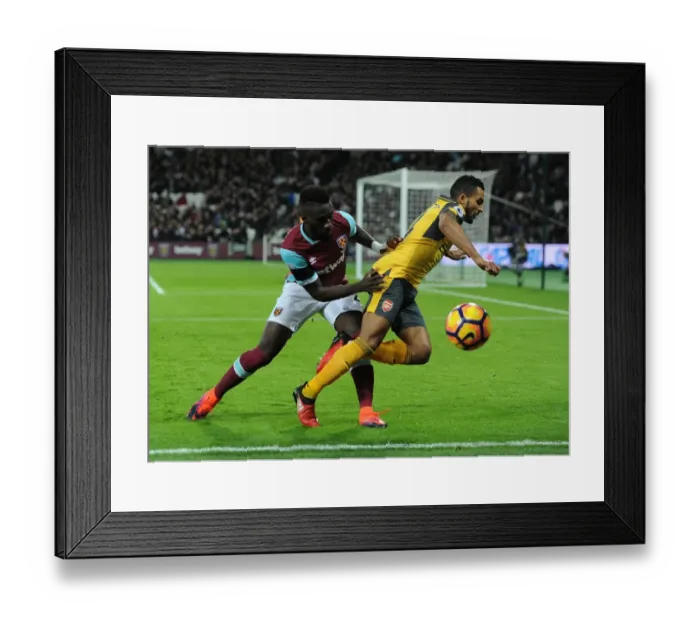 Framed Print : Theo Walcott vs. Arthur Masuaku: A Premier League Rivalry Ignites at London Stadium (2016-17)
