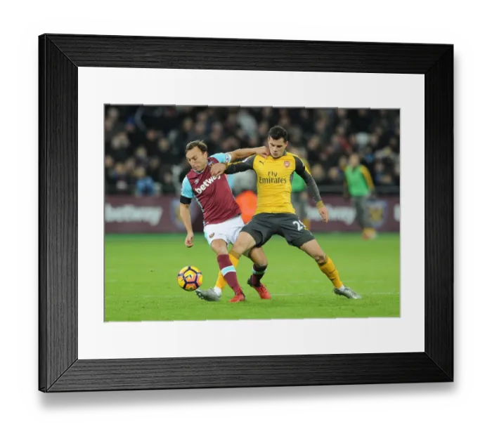 Framed Print : Xhaka vs Noble: Intense Battle in West Ham United vs Arsenal Premier League Clash Framed Print : Xhaka vs Noble: Intense Battle in West Ham United vs Arsenal Premier League Clash