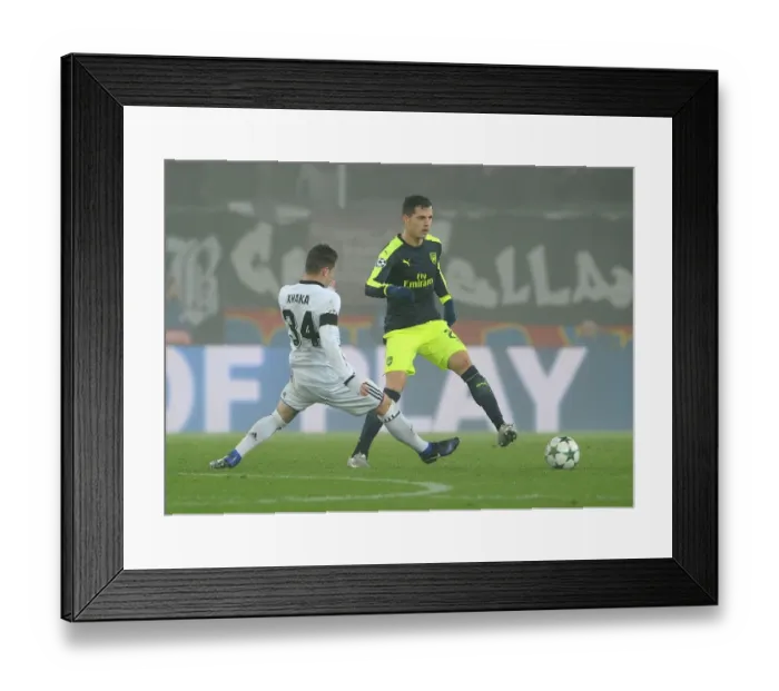 Framed Print : Clash of the Xhakas: Granit vs. Taulant, Arsenal's Battle at St. Jakob-Park, UEFA Champions League, Basel, Switzerland, 2016