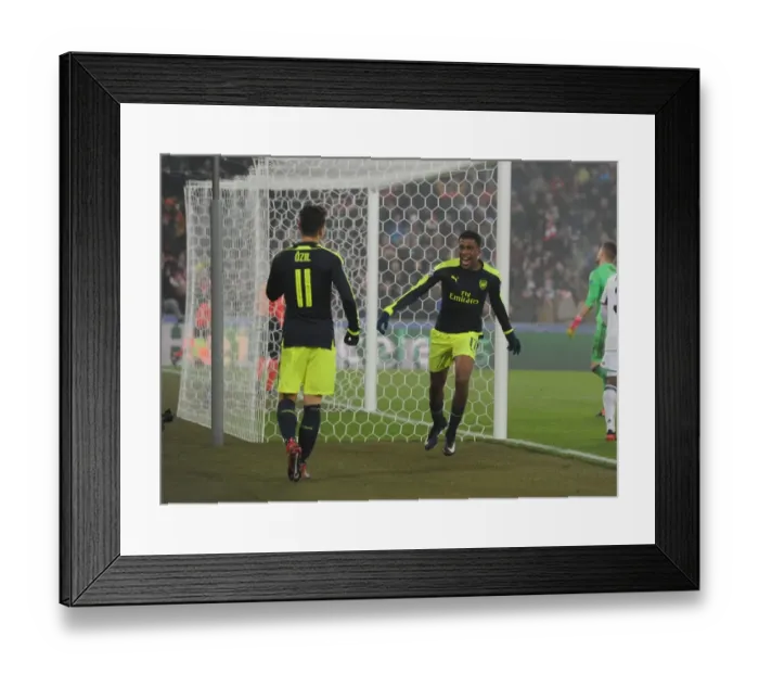 Framed Print : Arsenal's Alex Iwobi and Mesut Ozil Celebrate Goals Against FC Basel in 2016-17 UEFA Champions League