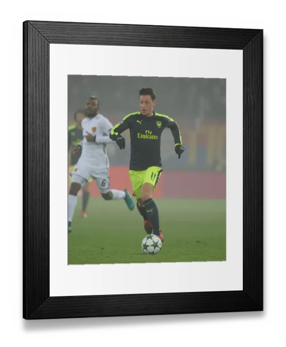 Framed Print : Mesut Ozil's Standout Performance: Arsenal's Victory over FC Basel in the UEFA Champions League (2016)