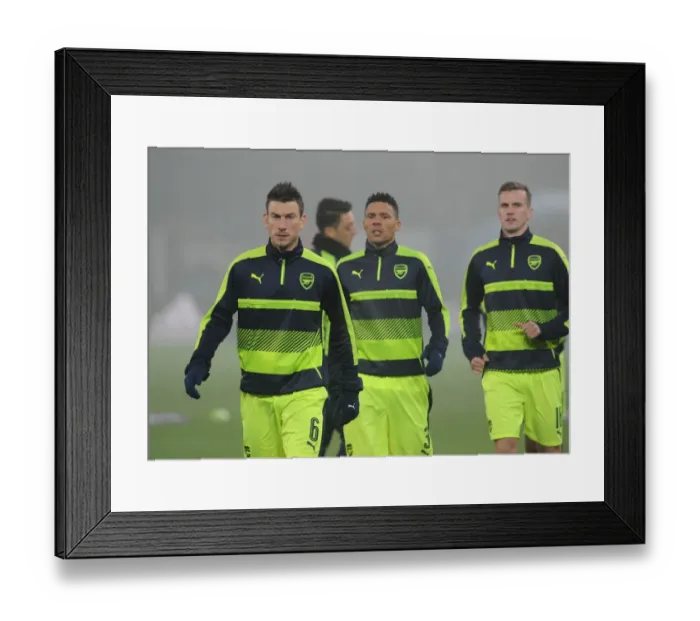 Framed Print : Arsenal's Laurent Koscielny Warming Up Ahead of FC Basel Clash in 2016-17 UEFA Champions League