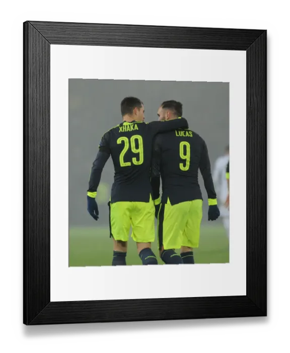 Framed Print : Lucas Perez and Granit Xhaka Celebrate Arsenal's Third Goal vs. FC Basel in 2016-17 UEFA Champions League