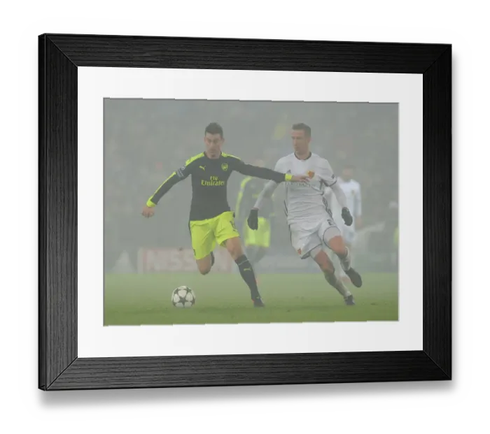 Framed Print : Arsenal vs. FC Basel: Laurent Koscielny Faces Off Against Marc Janko in 2016-17 UEFA Champions League Clash